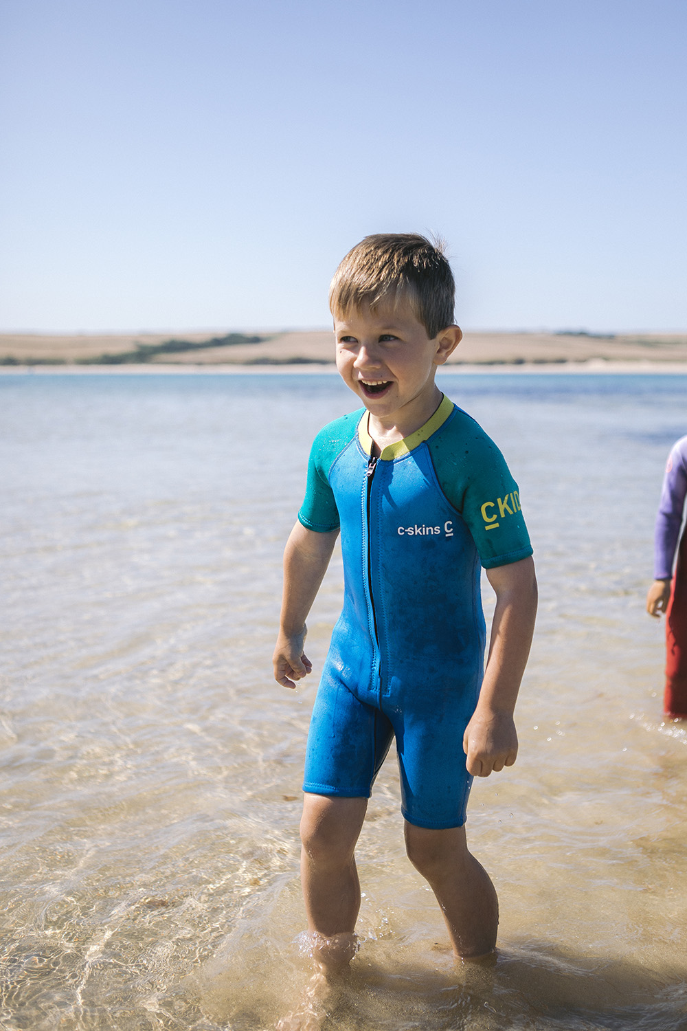 d-cskins-kids-baby-flatlock-shortie- wetsuit-cyan-green-yellow